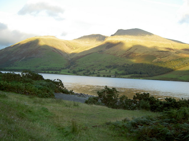 A scenic landscape of a lake, hills and mountains complements content about the history of radio countdowns.